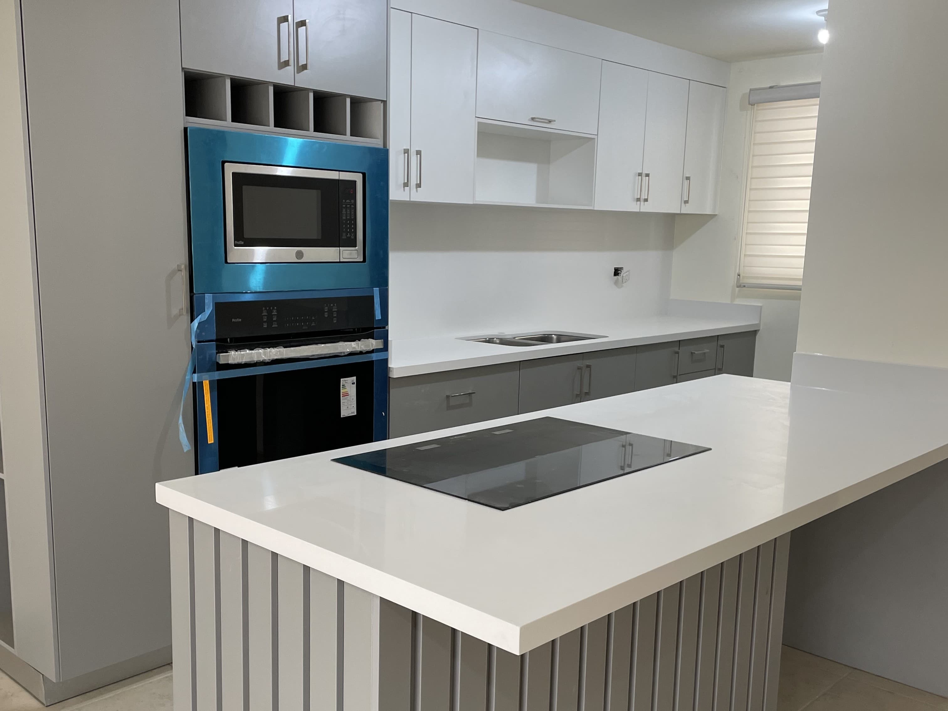 Sleek glass and steel commercial high-rise reflecting the sky